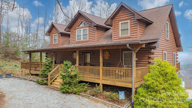 a front view of a house with plants