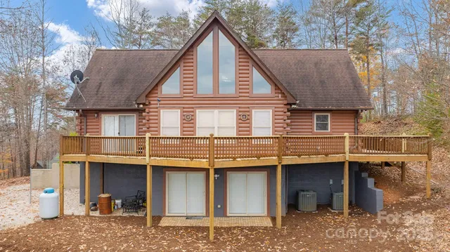 a view of a house with a balcony and barbeque area