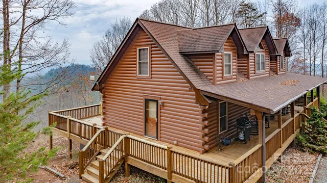 a view of mountain with a forest