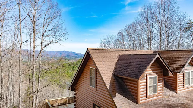 a view of deck with mountain view and wooden floor
