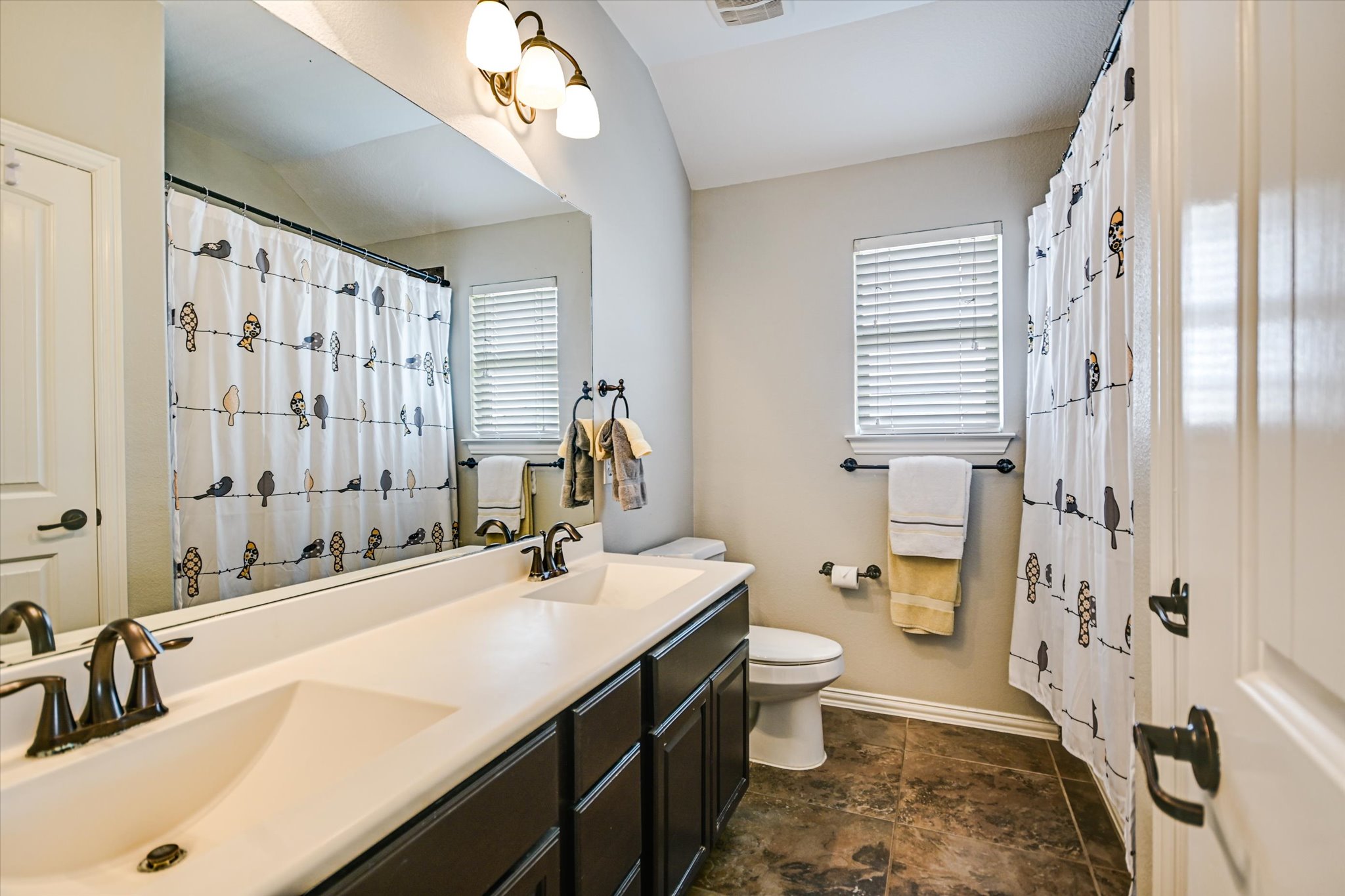 4623 Chestnut Meadows Bend Georgetown, TX 78626 - Photo 22 of 30 a bathroom with a double vanity sink toilet and shower