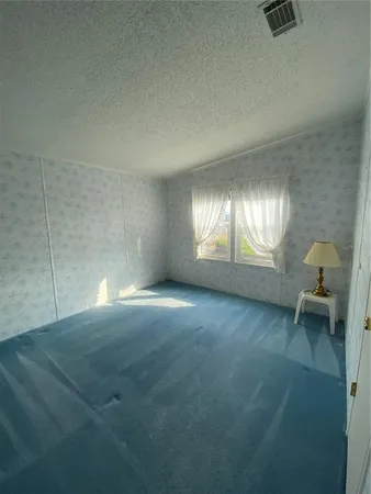 a view of empty room with windows