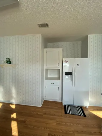 a view of a livingroom with wooden floor