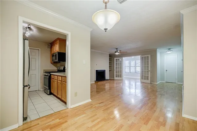 a view interior of kitchen and hall with wooden floor