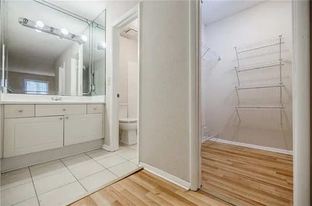 a bathroom with a shower and a sink