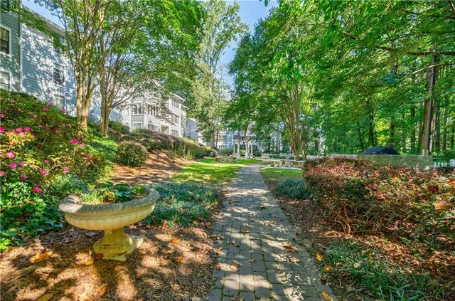 a view of a garden with a fountain