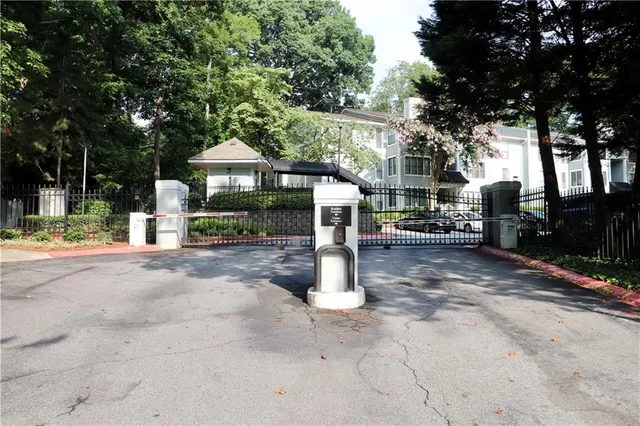a view of a house with a yard and tree s