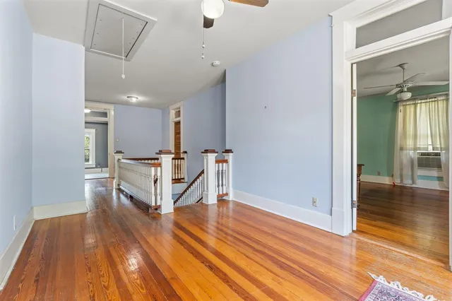 a view of a livingroom with furniture and wooden floor