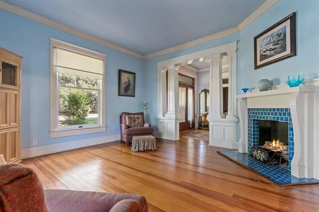 a living room with furniture and a fireplace
