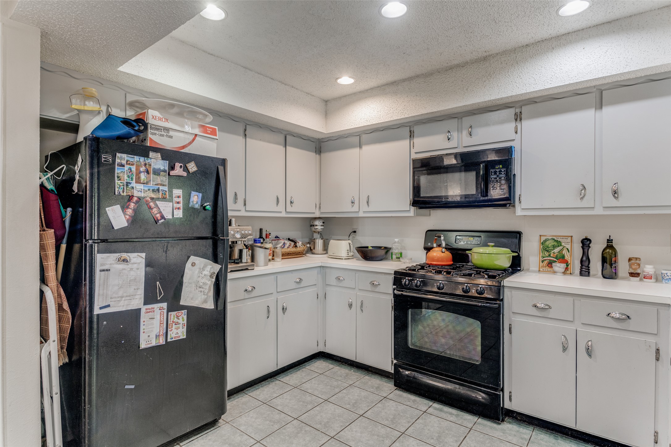 2713 Tether Trail Austin, TX 78704 - Photo 12 of 22 a kitchen with stainless steel appliances granite countertop a refrigerator a sink a stove top oven a counter space and cabinets