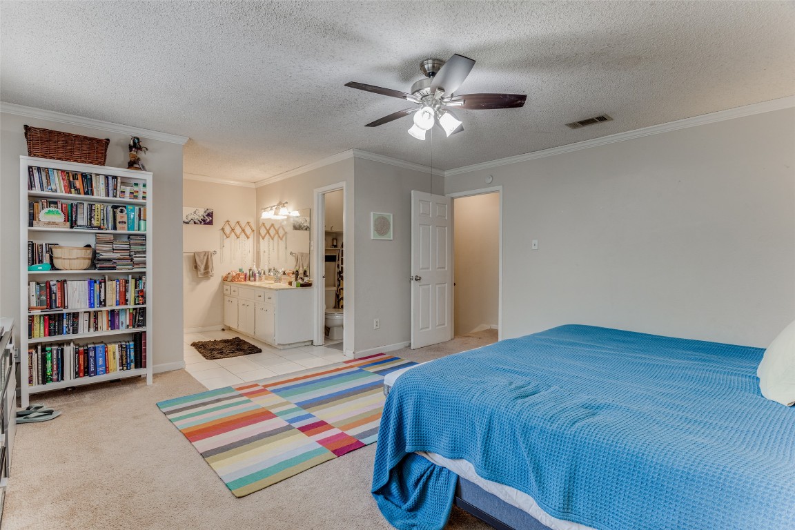 2713 Tether Trail Austin, TX 78704 - Photo 14 of 22 a bed room with a bed and a book shelf