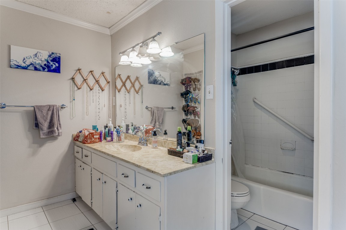 2713 Tether Trail Austin, TX 78704 - Photo 15 of 22 a bathroom with a sink vanity mirror and toilet