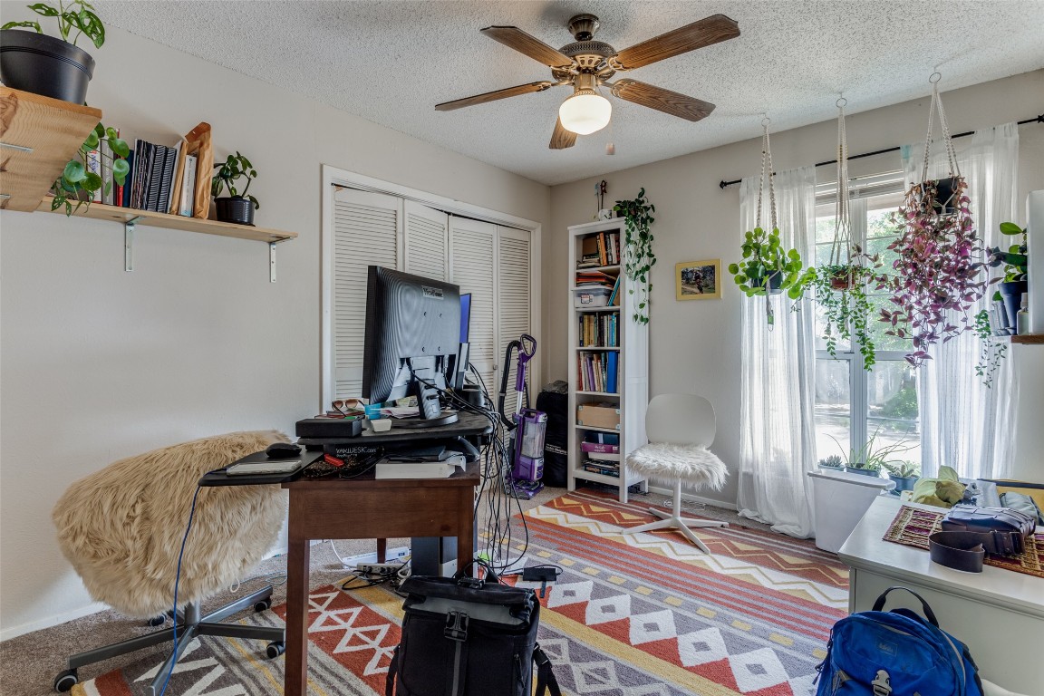 2713 Tether Trail Austin, TX 78704 - Photo 17 of 22 a view of a workspace with furniture and a potted plant