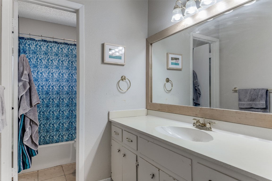 2713 Tether Trail Austin, TX 78704 - Photo 19 of 22 a bathroom with a sink and a mirror