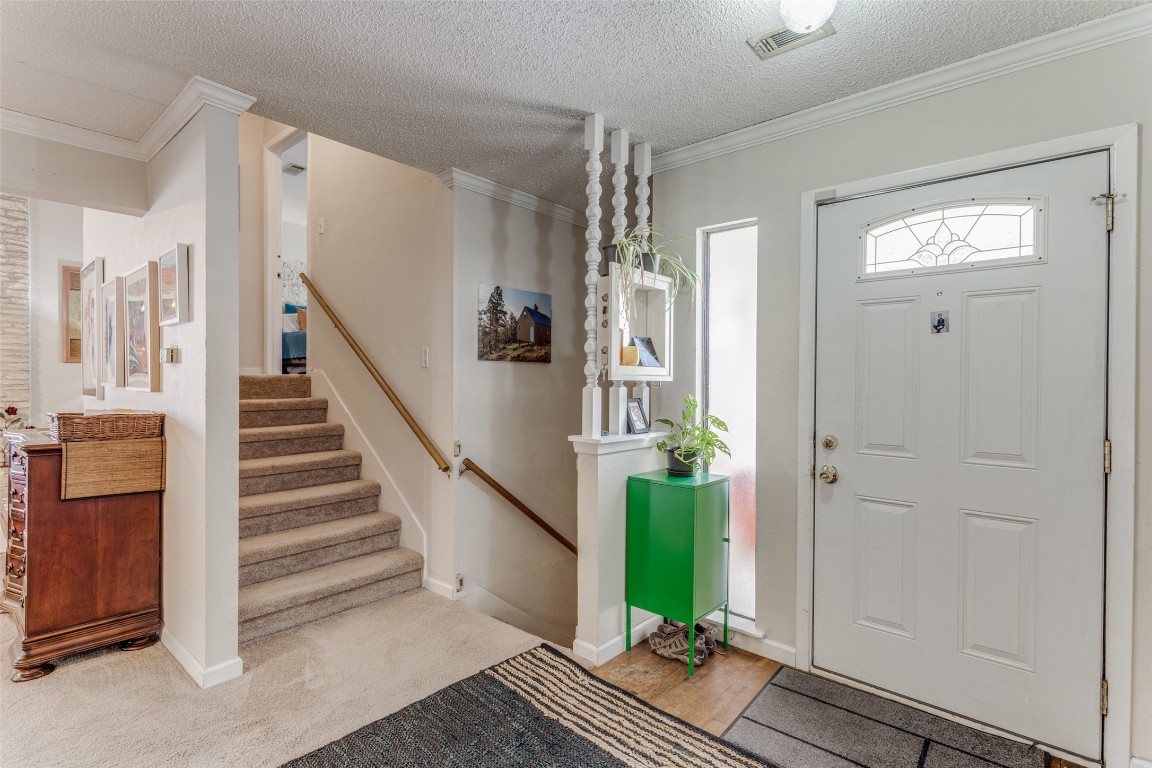 2713 Tether Trail Austin, TX 78704 - Photo 2 of 22 a view of entryway with wooden floor and stairs
