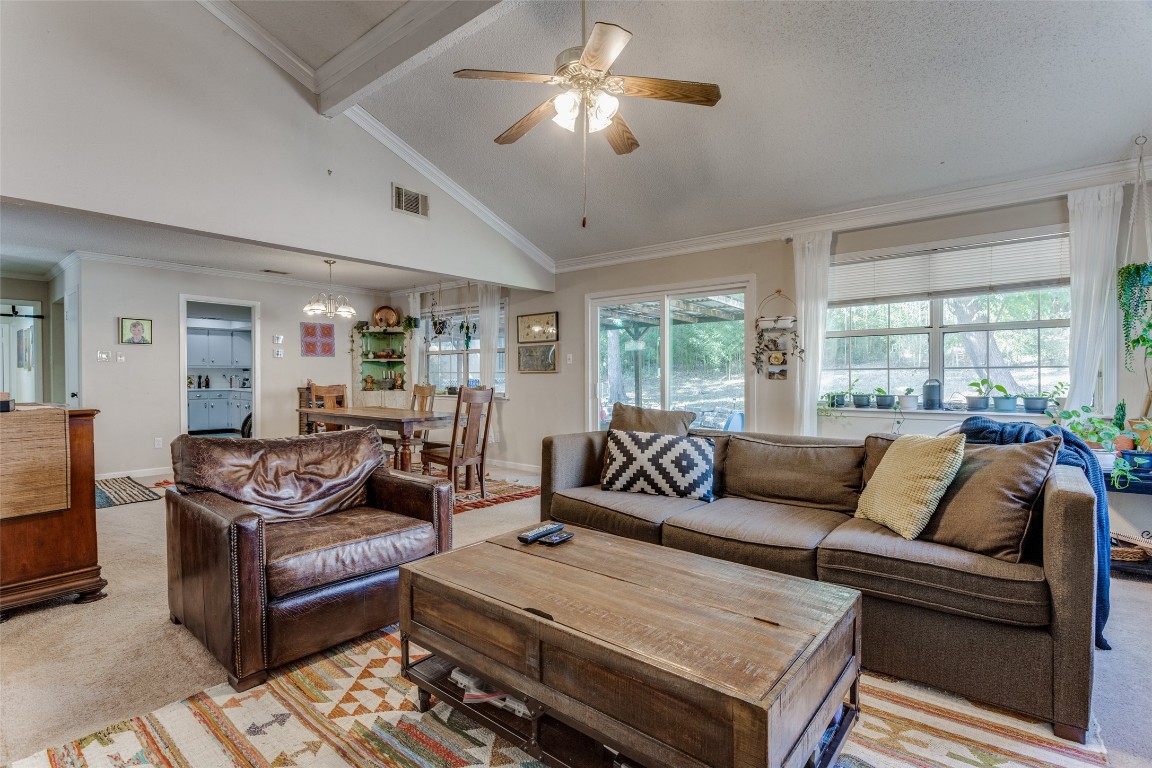 2713 Tether Trail Austin, TX 78704 - Photo 5 of 22 a living room with furniture ceiling fan and a rug