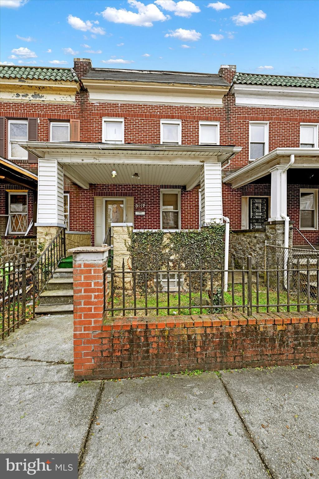 3117 Baker Street Baltimore, MD 21216 - Photo 1 of 17 a front view of a house