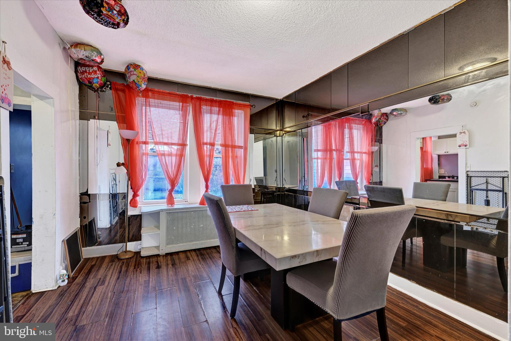 3117 Baker Street Baltimore, MD 21216 - Photo 4 of 17 a dining room with furniture and wooden floor