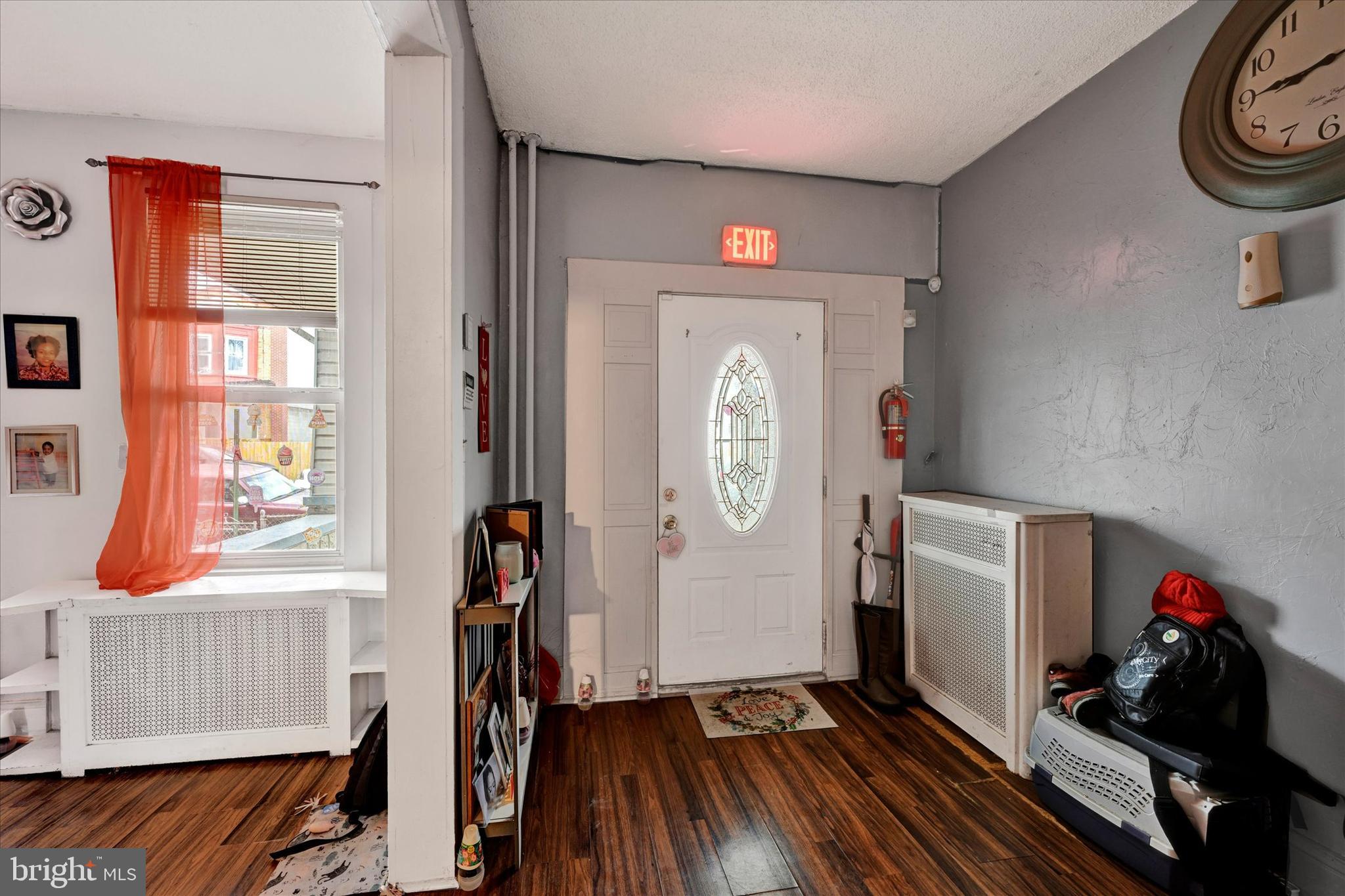 3117 Baker Street Baltimore, MD 21216 - Photo 8 of 17 a view of entryway with wooden floor