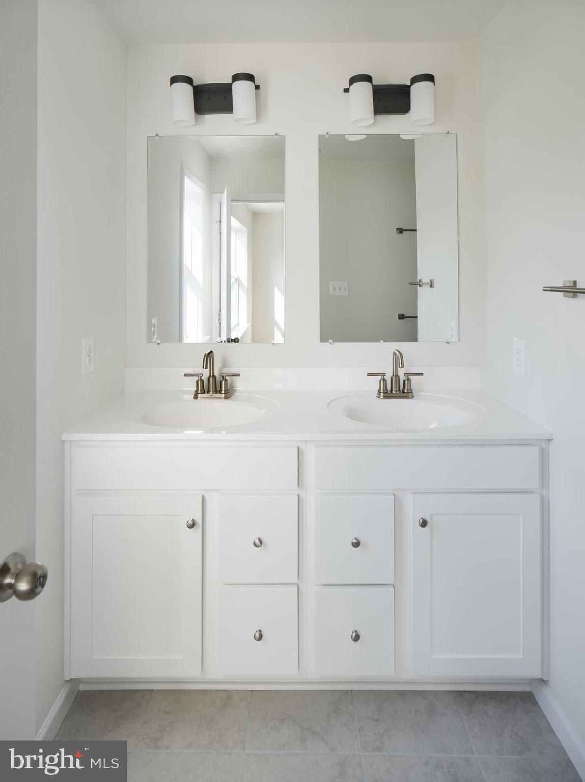 2615 Front Shed Drive Frederick, MD 21702 - Photo 32 of 78 a bathroom with a sink vanity and a mirror