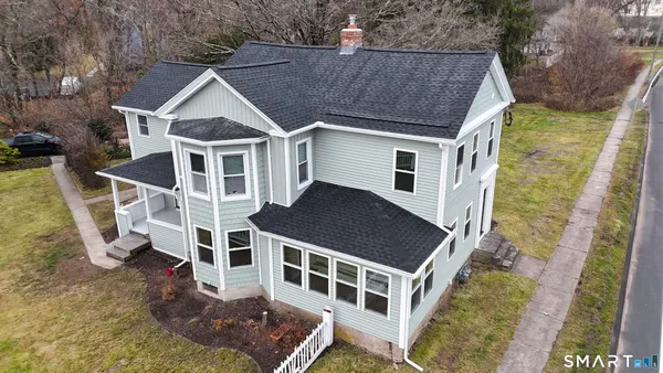 a aerial view of a house with a yard