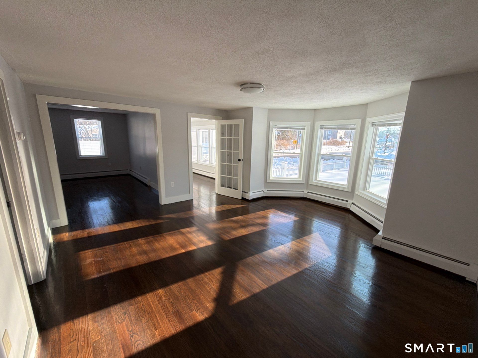 610 Ives Row Cheshire, CT 06410 - Photo 11 of 23 wooden floor in an empty room with a window