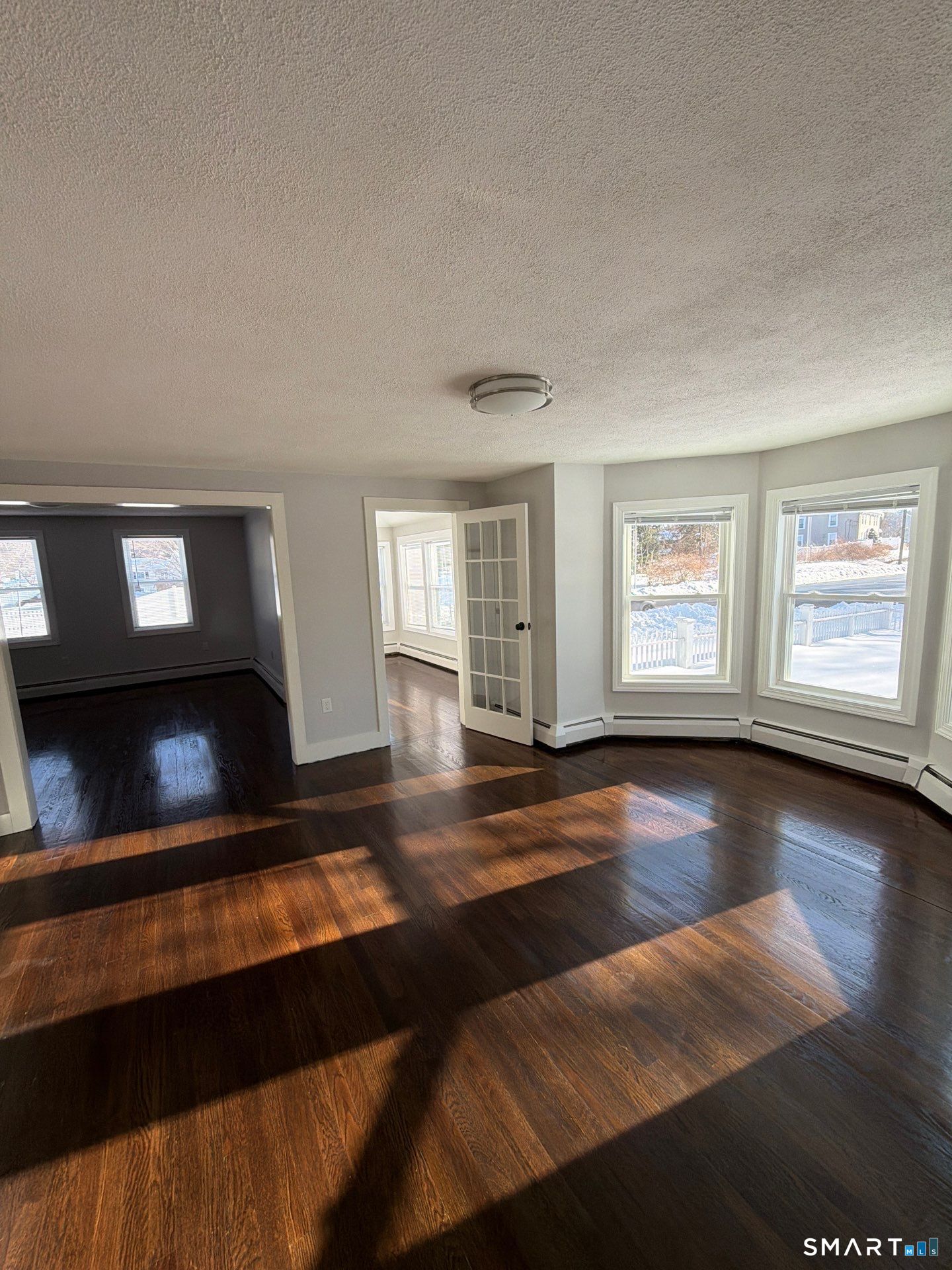 610 Ives Row Cheshire, CT 06410 - Photo 12 of 23 a living room with hardwood floor and a window