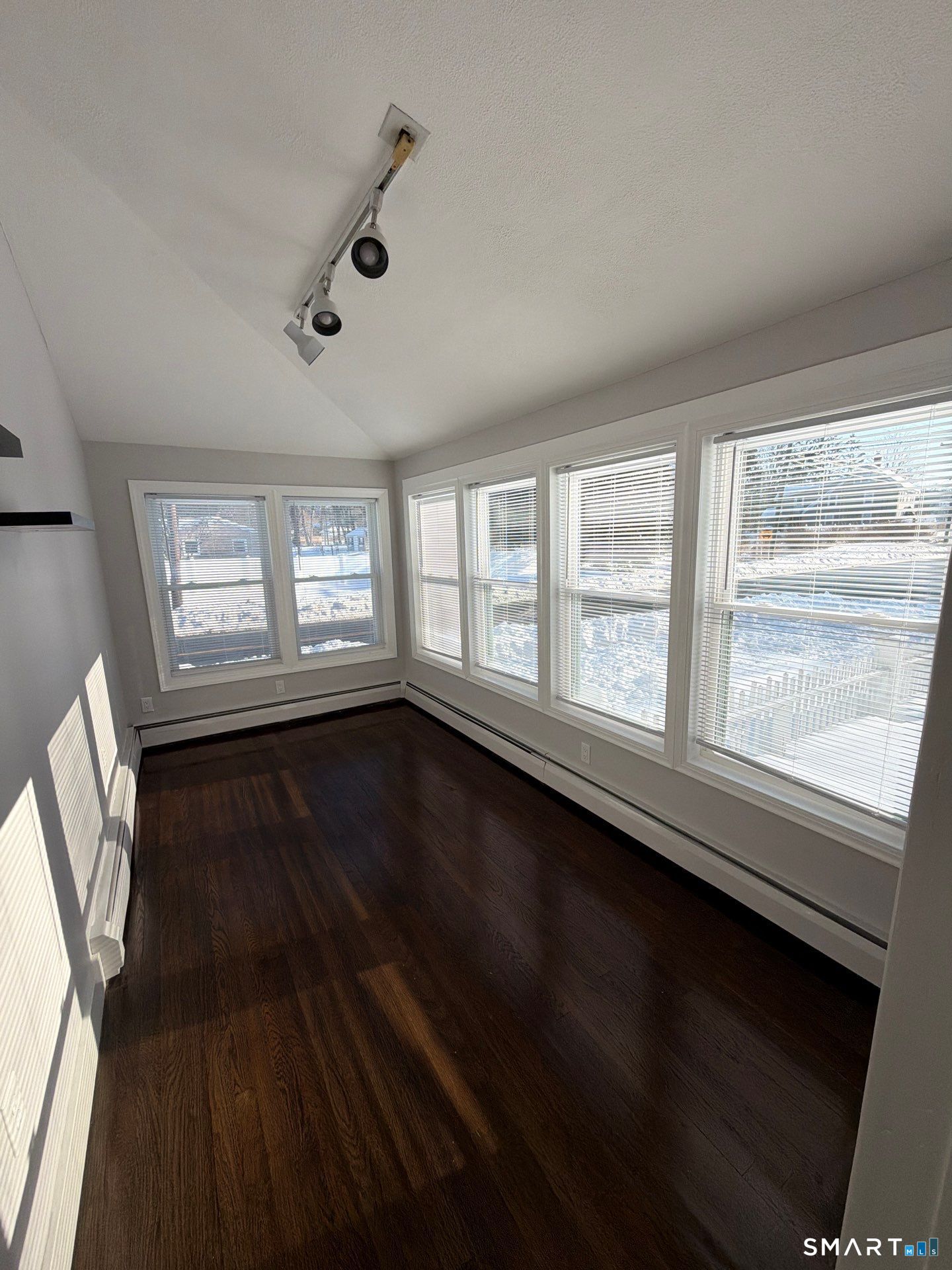 610 Ives Row Cheshire, CT 06410 - Photo 14 of 23 a view of an empty room with wooden floor and a window