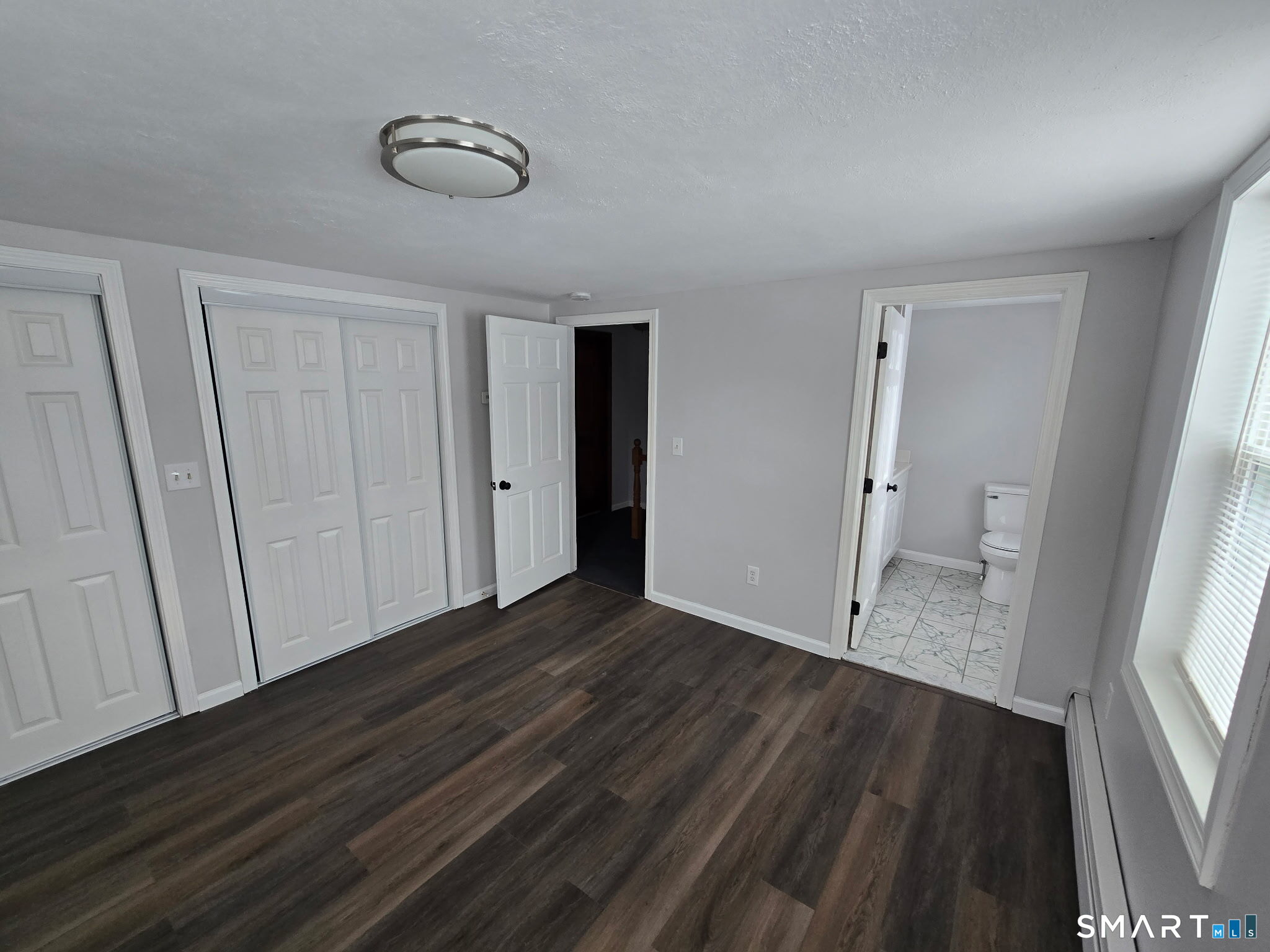 610 Ives Row Cheshire, CT 06410 - Photo 19 of 23 wooden floor in an empty room with a window
