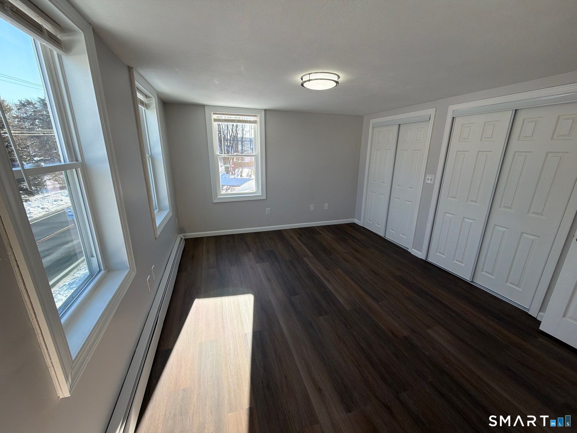 610 Ives Row Cheshire, CT 06410 - Photo 23 of 23 a view of hallway with window and wooden floor