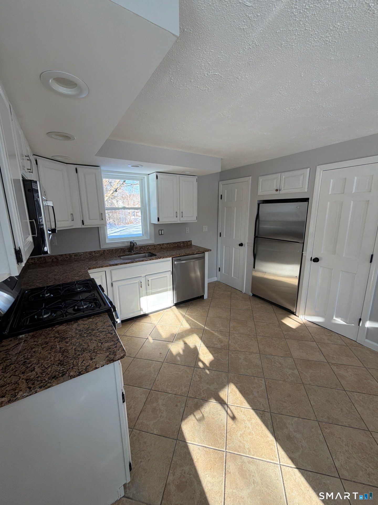 610 Ives Row Cheshire, CT 06410 - Photo 7 of 23 a kitchen with a stove and a refrigerator