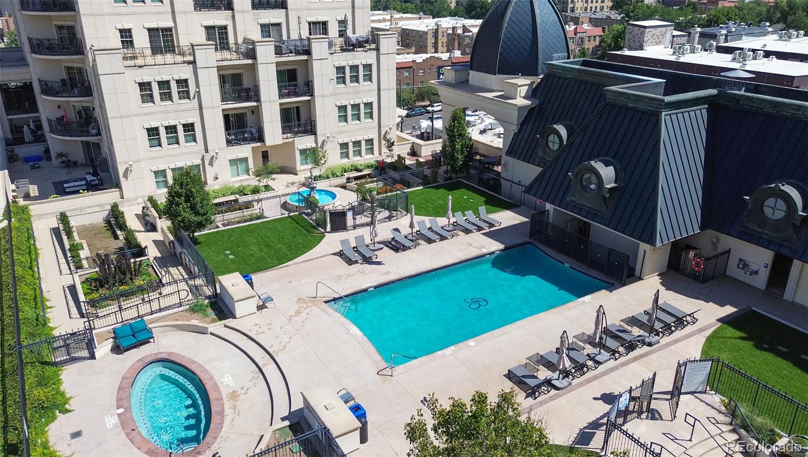 a view of a patio with table and chairs potted plants