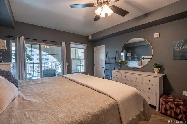 a bedroom with a large bed and a dresser