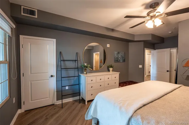 a bedroom with a bed and a dresser
