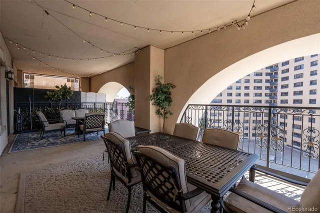 a dinning table and chairs in a patio