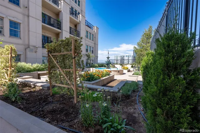 a view of a patio with couches and potted plants