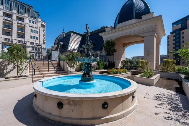 a view of a chairs and table in backyard
