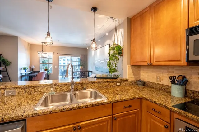 a kitchen with a sink and cabinets