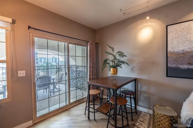 a view of a workspace with furniture and window