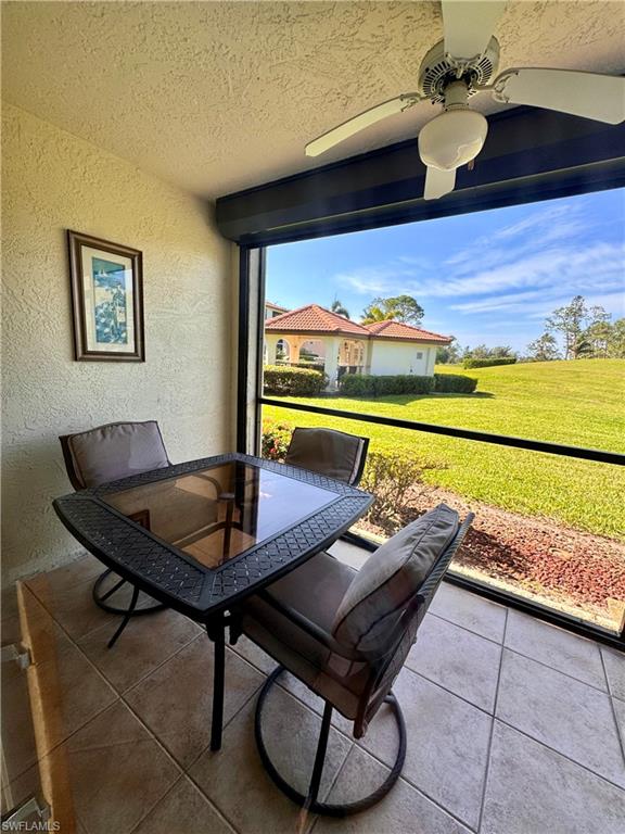 605 Augusta Boulevard, Unit 4 Naples, FL 34113 - Photo 14 of 14 a living room with dining table and a wooden floor