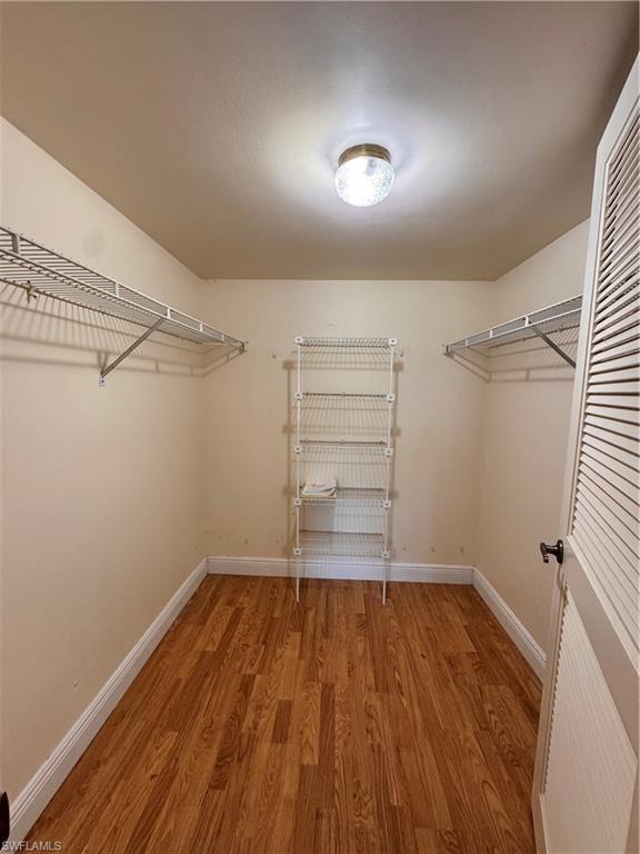 605 Augusta Boulevard, Unit 4 Naples, FL 34113 - Photo 6 of 14 a view of a room with wooden floor