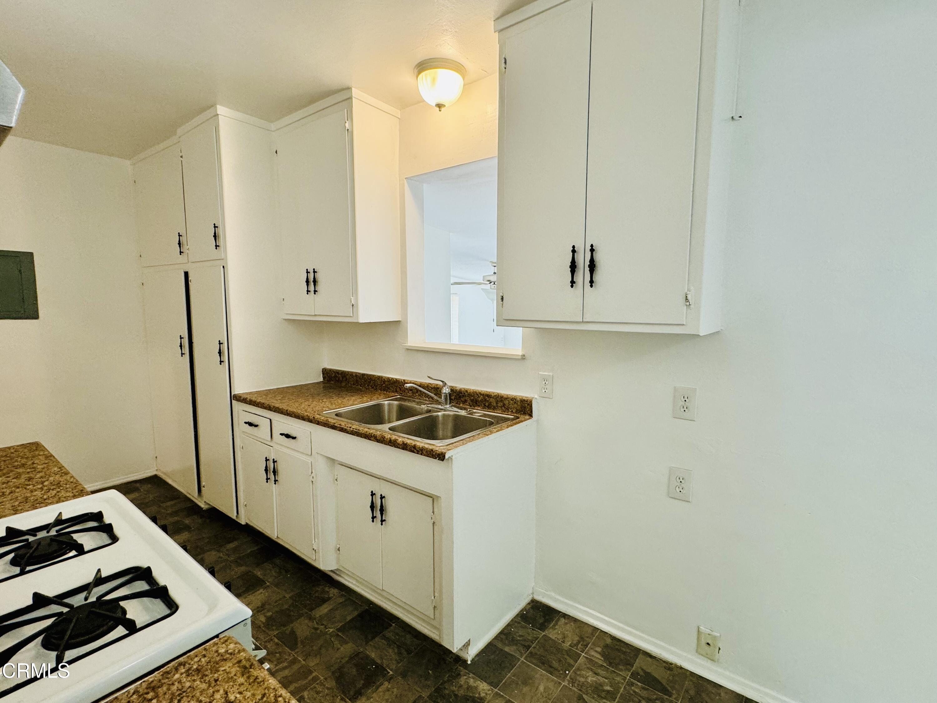 550 MacDonald Street Pasadena, CA 91103 - Photo 11 of 63 a kitchen with a stove and a microwave