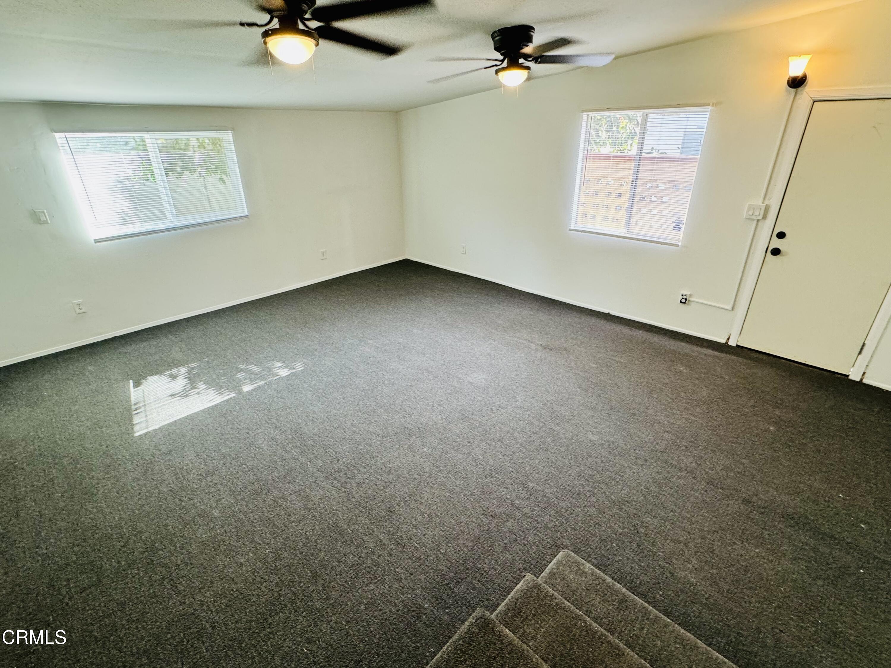550 MacDonald Street Pasadena, CA 91103 - Photo 16 of 63 en empty room with windows and ceiling fan