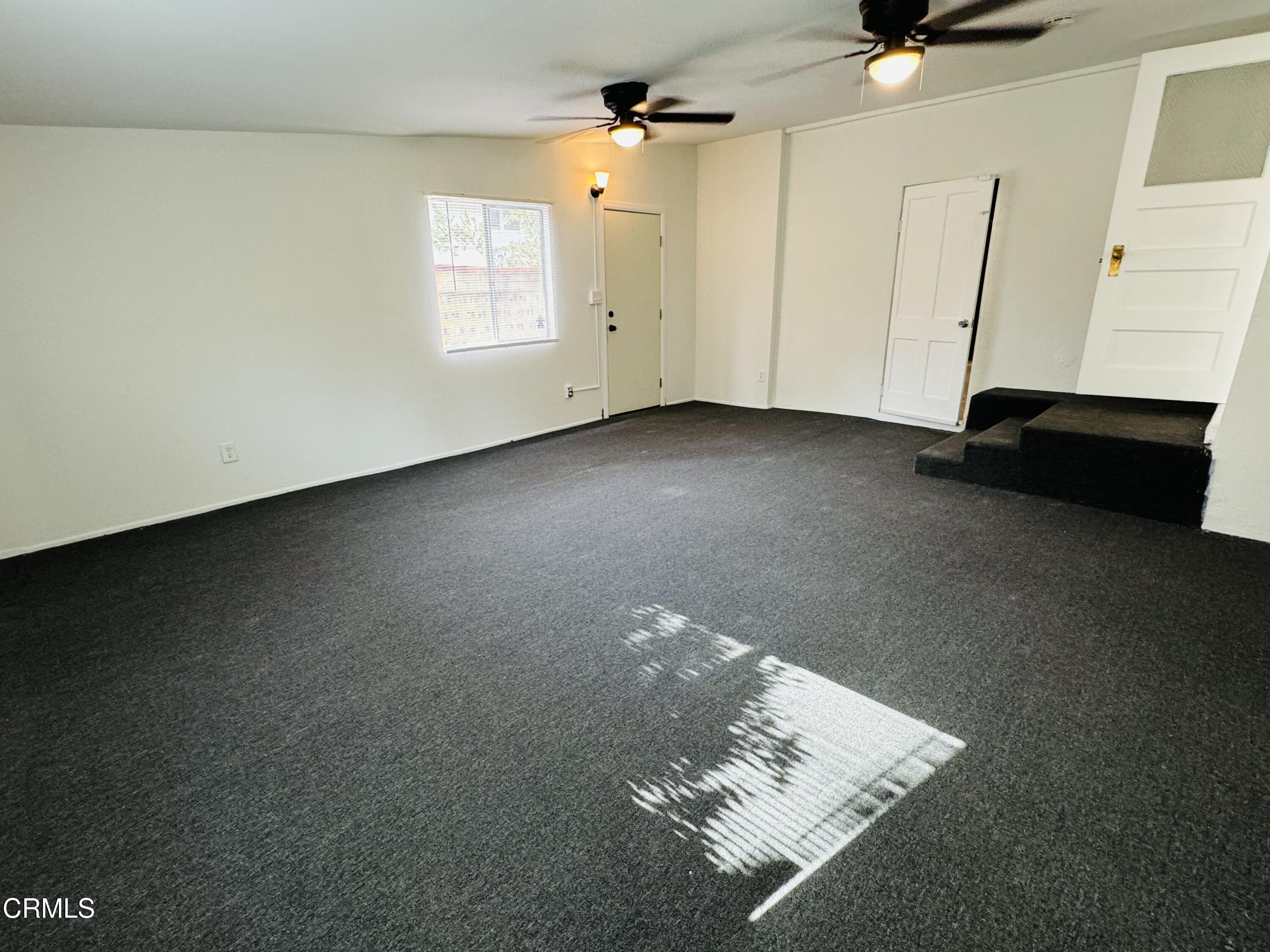 550 MacDonald Street Pasadena, CA 91103 - Photo 18 of 63 en empty room with windows and ceiling fan