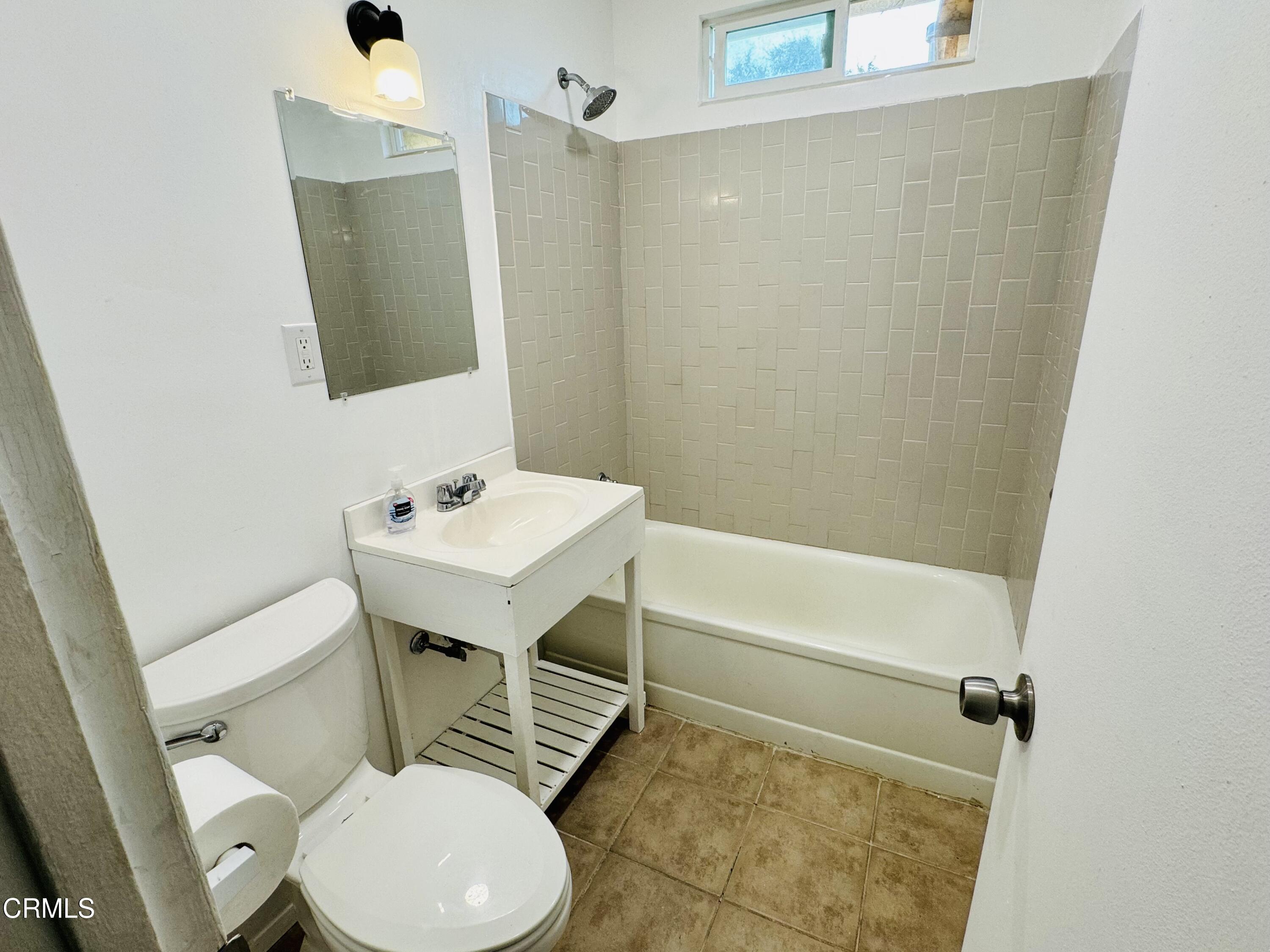 550 MacDonald Street Pasadena, CA 91103 - Photo 25 of 63 a bathroom with a sink a toilet and a mirror