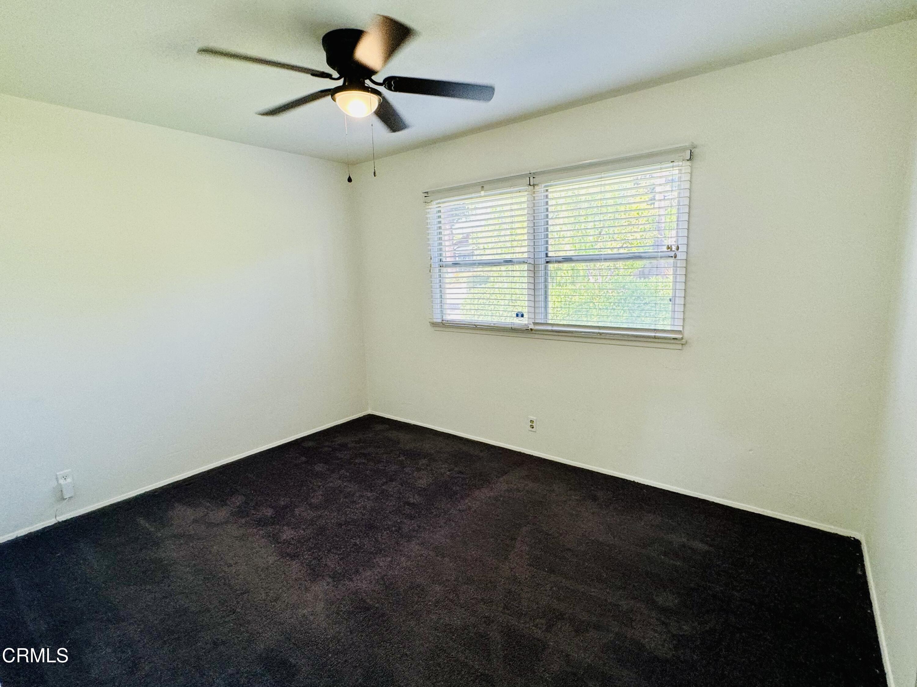 550 MacDonald Street Pasadena, CA 91103 - Photo 27 of 63 an empty room with a window and a fan