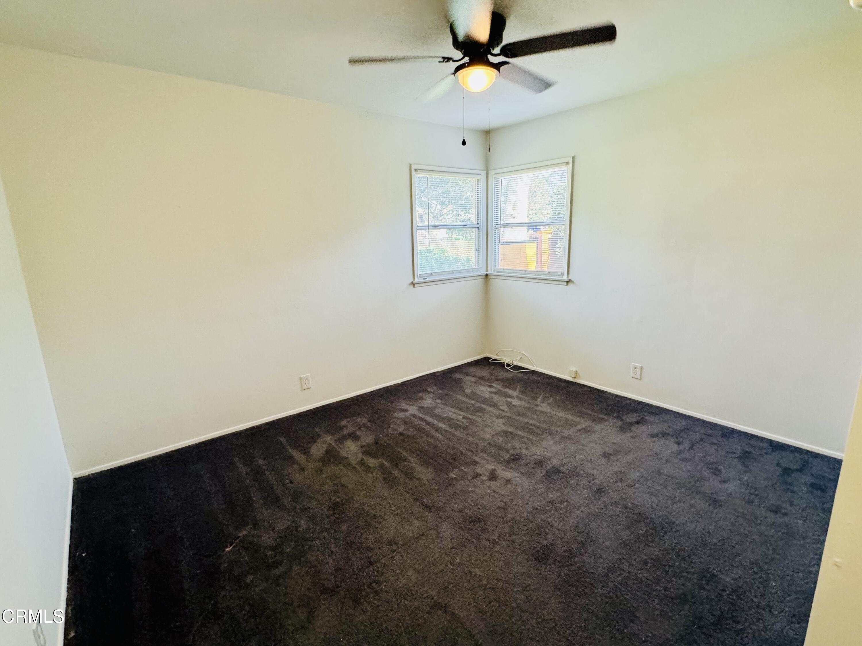 550 MacDonald Street Pasadena, CA 91103 - Photo 29 of 63 an empty room with a window and a fan