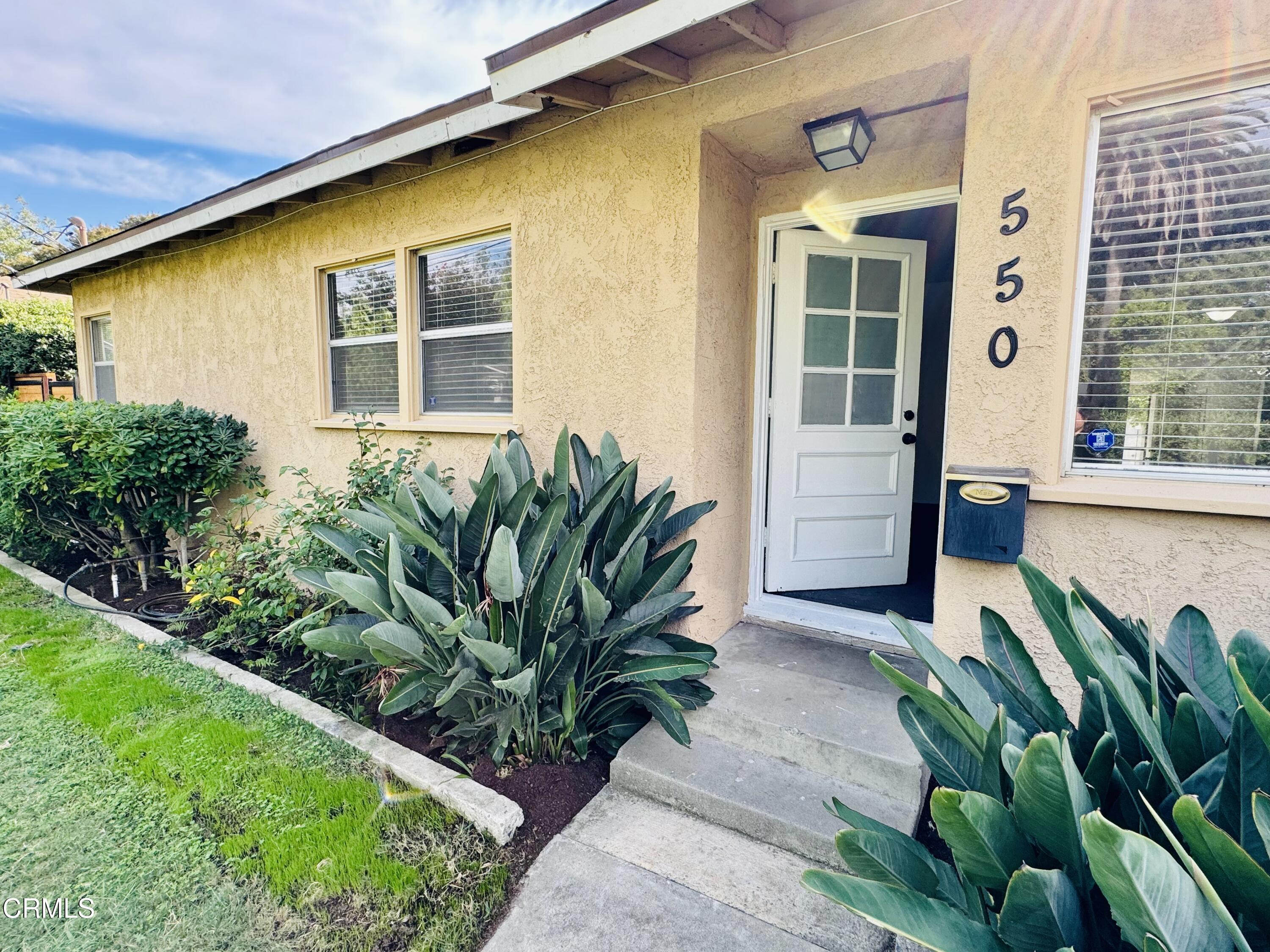 550 MacDonald Street Pasadena, CA 91103 - Photo 4 of 63 a front view of a house with a garden