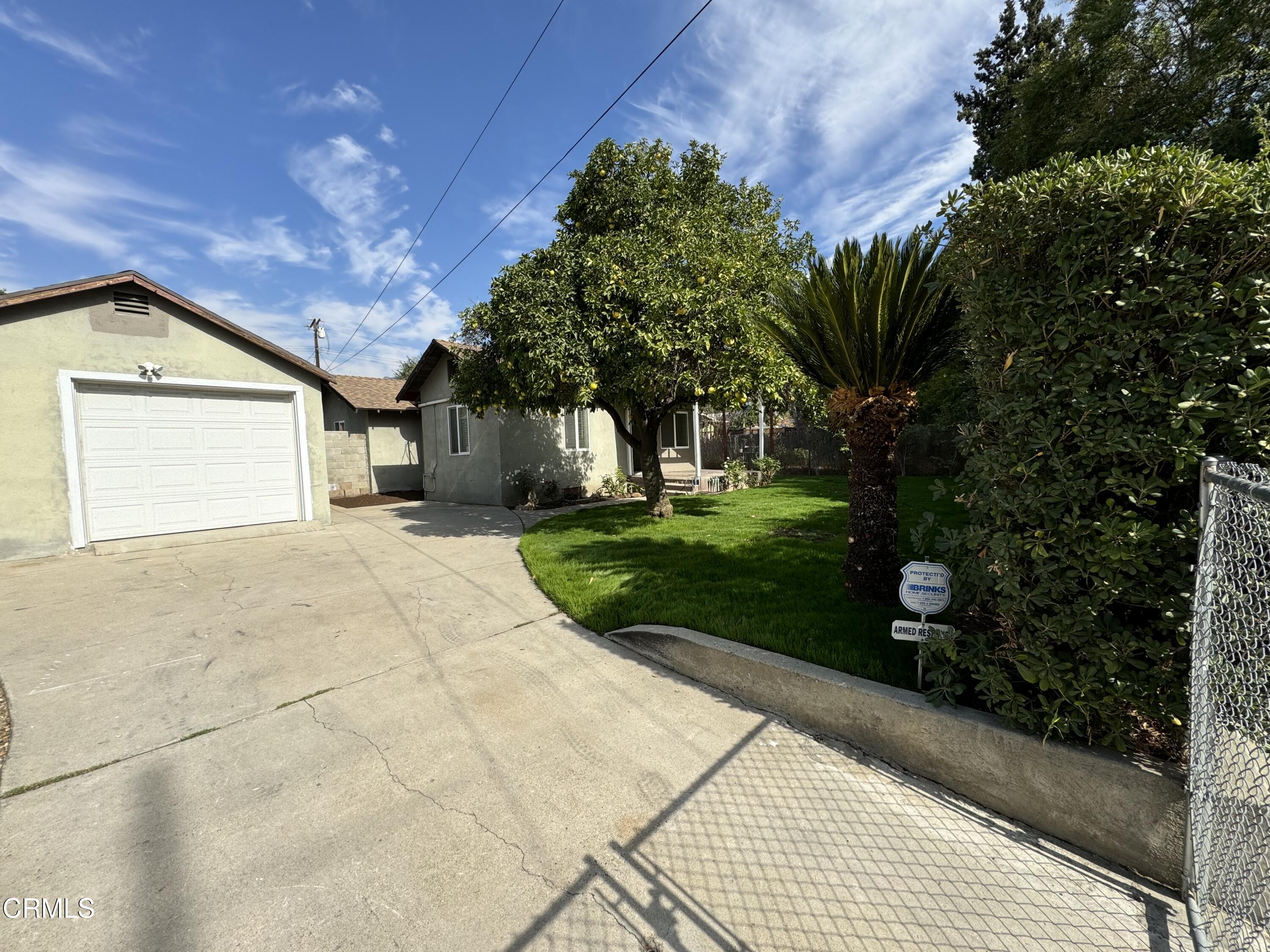 550 MacDonald Street Pasadena, CA 91103 - Photo 42 of 63 a view of a house with a yard and potted plants