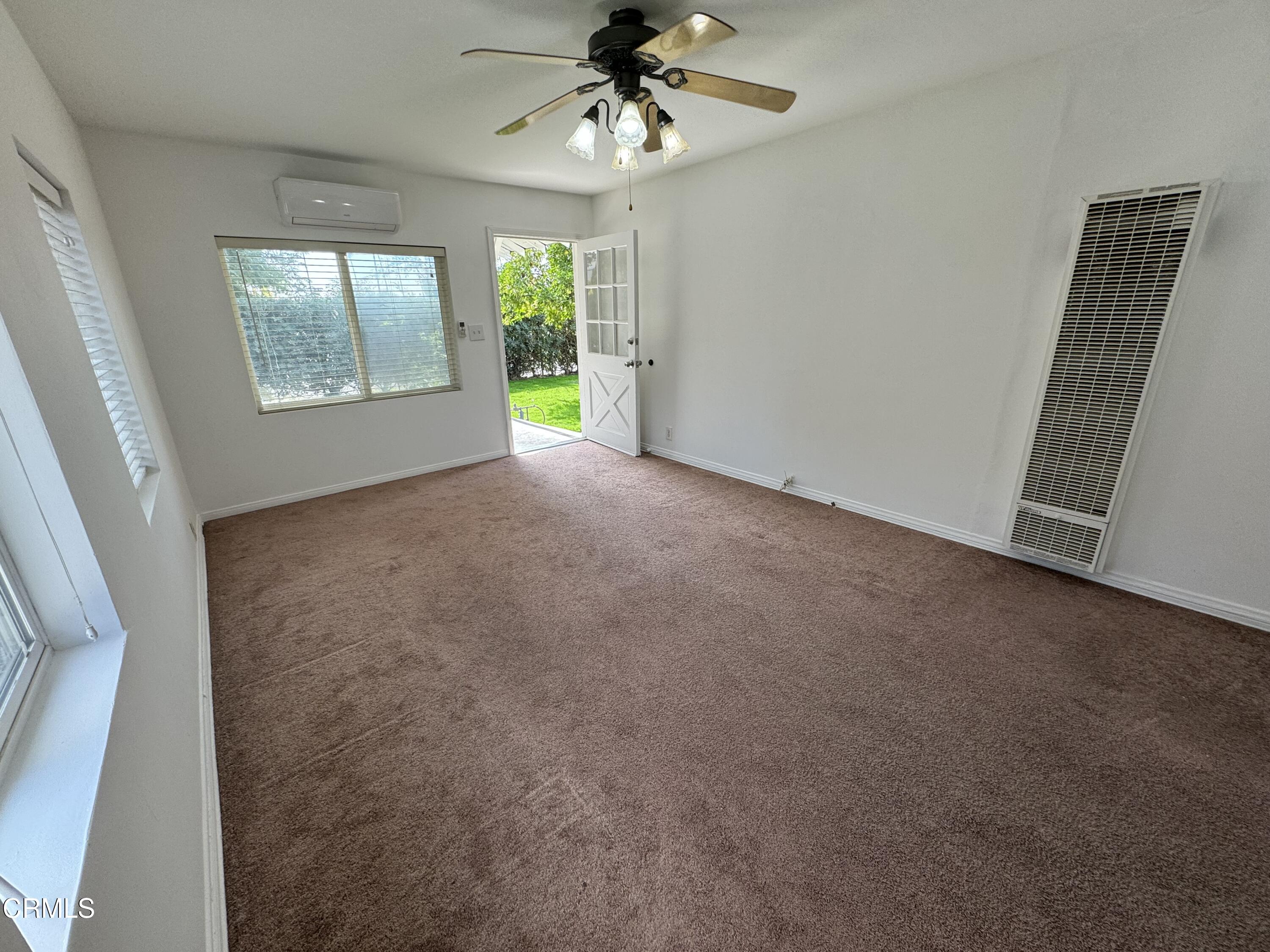 550 MacDonald Street Pasadena, CA 91103 - Photo 44 of 63 an empty room with windows and chandelier fan